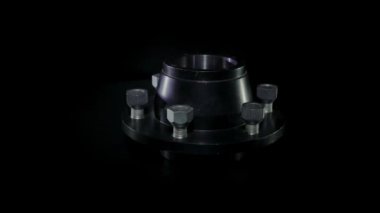 Çelik merkez siyah bir arkaplanda dönüyor. Demir göbek izole edildi