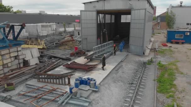 Factory for the assembly of metal structures. Flying over the workshop for the assembly of metal structures. Industrial exterior. Plant top view — Stock Video