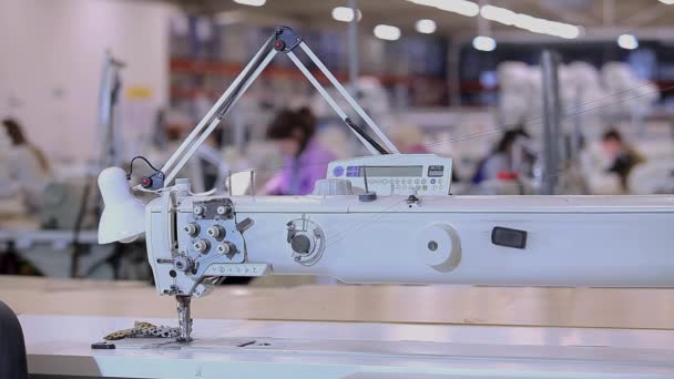 Equipment at a garment factory. Sewing machine close-up. Professional sewing equipment close-up. — Vídeo de Stock