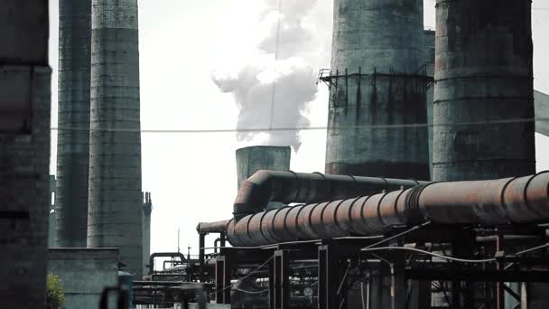 Thick white smoke from the chimney of a metallurgical plant. White smoke from a large chimney of a factory. — Stock Video