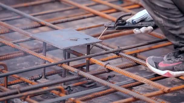 Welder at a construction site. Working process at a construction site. Welder close-up. Metal structures — Stock Video