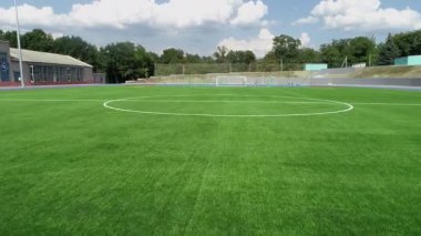 Green soccer field. Flying over the grass of the soccer field. New green soccer field