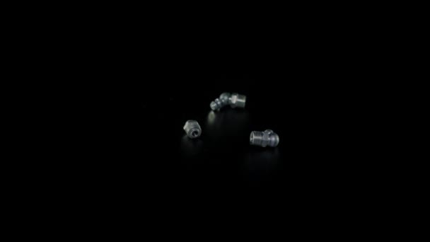 Bolt with nut on a black background close-up. Bolt with nut rotates on a black background — Stockvideo