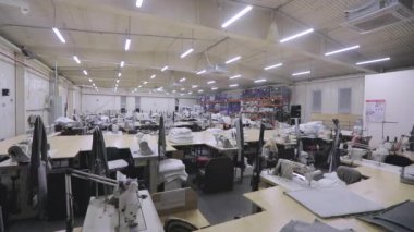 Turning off the lights in a garment factory. End of the working day at the factory. Turning off the lights in the factory. End of a working day at a garment factory