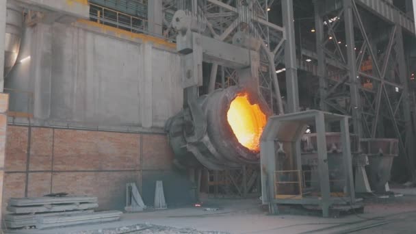 Hot metal ladle. Industrial interior at a metallurgical plant. Sparks from hot metal slow motion — Stock Video