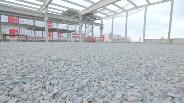 Construction of a large industrial building. Construction site with reinforced concrete structure. Industrial interior at a construction site. — Stock Video