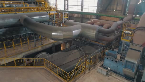 Large diameter pipes in an industrial workshop. Inside an industrial plant. Large metal pipes in the factory — Stock Video