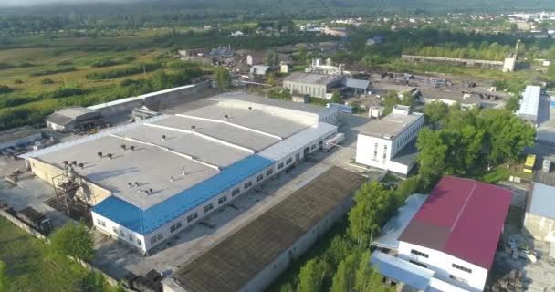 Large factory in an ecologically clean region. Big factory top view. A modern plant in a rural area drone view. — Stock Video