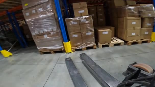 Work of special equipment in the warehouse, pov. The work of a forklift in a warehouse pov. Modern forklift works in a warehouse. — Stock Video