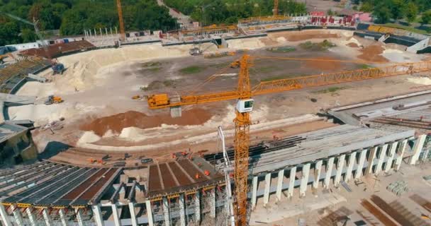 Builders are building a stadium top view. Construction site. Creation of metal structures during the construction of a stadium — Video Stock