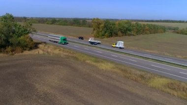 The truck will transport the animals. Truck on the track transports animals. Truck with animals.