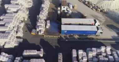 Warehouse of finished products near the factory. Large outdoor warehouse. Large warehouse near the factory.