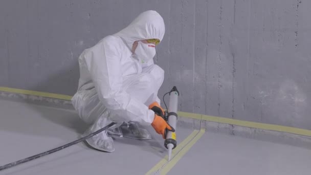 Builder Covers Joint Seam Sealant Construction Worker Grouting Seams Concrete — 비디오