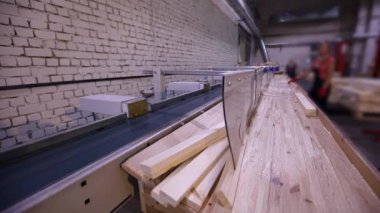 Furniture manufacture. Conveyor in a furniture factory. People work on the pavement.