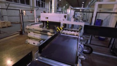 Furniture factory, interior furniture factory. Modern machines at a woodworking factory.