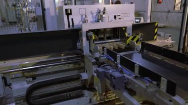 Furniture factory, interior furniture factory. Modern machines at a woodworking factory.