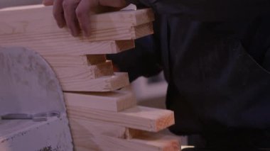 Working with hands close up, working with wood close up. Workflow in a furniture factory.
