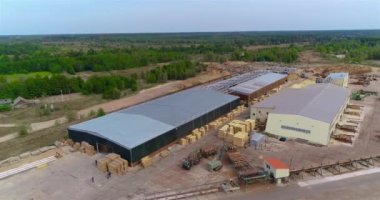 Work process on the sawmill aerial view, modern sawmill view from the top. Active work in the yard sawmill.