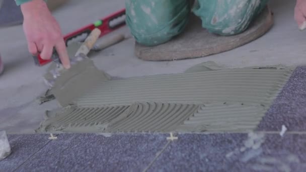 Builder Lays Tiles Cement Mortar Construction Worker Laying Tiles Floor — Stockvideo