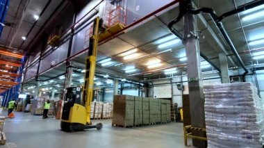 Modern forklift in a large warehouse. Forklift with cargo in the warehouse. industrial interior.