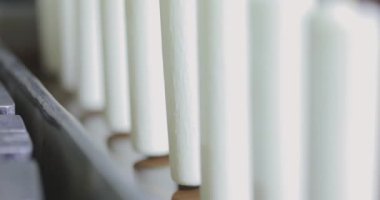 Ice cream is dipped in chocolate close-up. Ice cream production close-up.