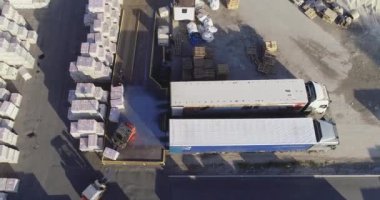 Warehouse of finished products near the factory. Large outdoor warehouse. Large warehouse near the factory.