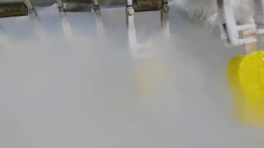 Freezing ice cream on the conveyor. Ice cream production process. Conveyor at the ice cream factory.