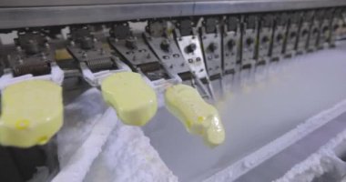 Freezing ice cream at the factory. Automatic production of ice cream. Ice cream production at the factory.