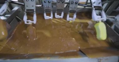 Freezing ice cream at the factory. Automatic production of ice cream. Ice cream production at the factory.