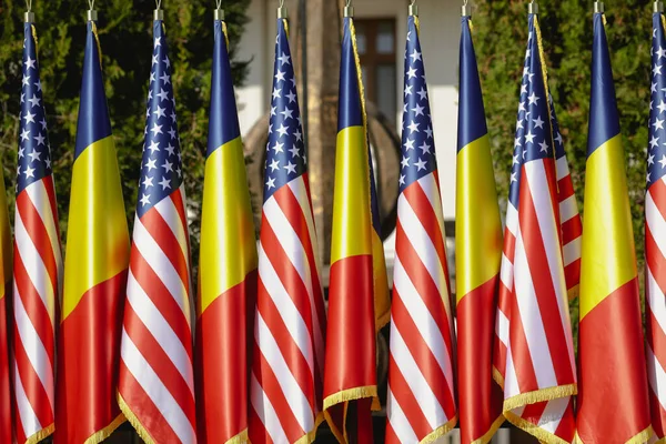 United States Romanian Flags Poles One Next Another — Stock Photo, Image