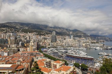 Monaco - April 19, 2022: Overview with the Monaco city and port during a spring sunny day with the F1 circuit construction under way.