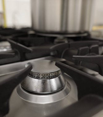 Sığ alan derinliği (seçici odak) ayrıntıları yepyeni, kullanılmayan, profesyonel metalik gaz yakıcı.