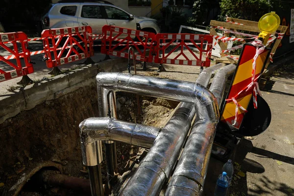 Bucharest, Romania - August 3, 2022: Pipes on a construction site to repair a RADET (Termoenergetica) pipeline in Bucharest.