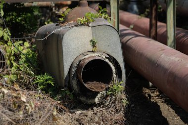 Details with old and rusty pipelines at a Romanian abandoned power plant.