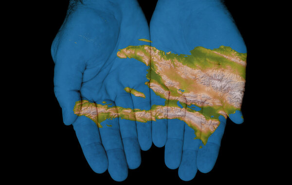 Map painted on hands showing concept of having Haiti in our hands