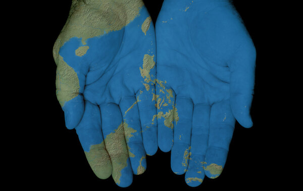 Map painted on hands showing concept of having the Philippine Islands in our hand