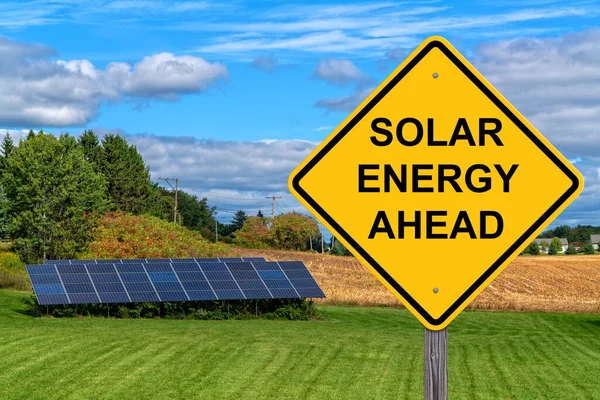 Solar Energy Ahead Caution Sign With Solar Panel Background