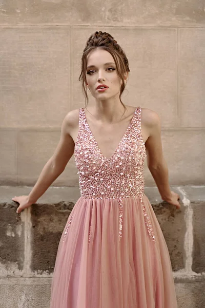 Portrait of beauiful European girl bridesmaid in classic pink dress — стокове фото