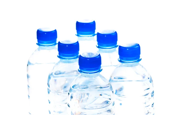 Seis garrafas de água perto — Fotografia de Stock