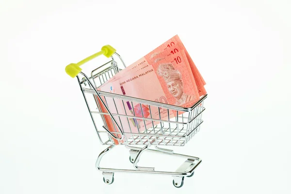 Malaysian ringgit in shopping cart — Stock Photo, Image