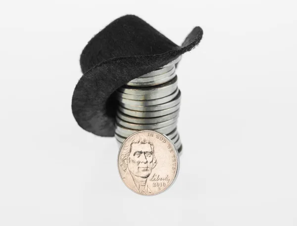 Black cowboy hat and nickel close up — 스톡 사진