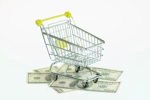 American one hundred dollars bills and shopping cart — Stock Photo, Image