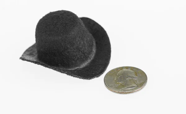 Cowboy hat and old quarter close up — Stock Photo, Image