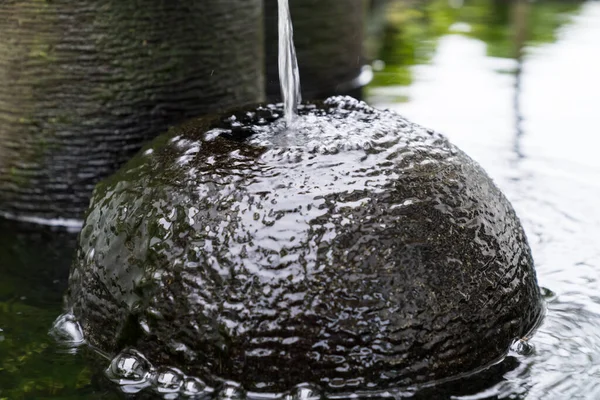 Water fountain feature in garden