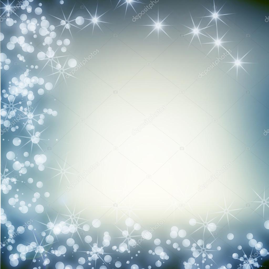 Blue abstract christmas background with white lights and stars and copy space for text