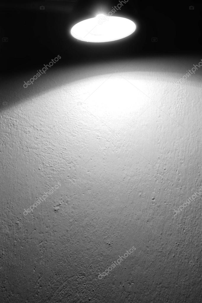 Wall background texture and spot light lamp and beam of light black and white background