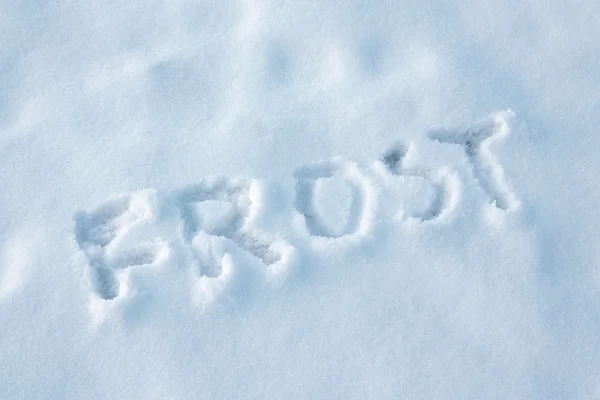 Text frost på snö ytan — Stockfoto