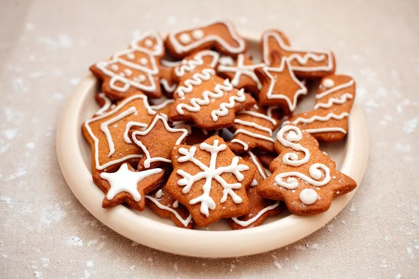 Plate of christmas cookies with festive decoration — Stock Photo, Image