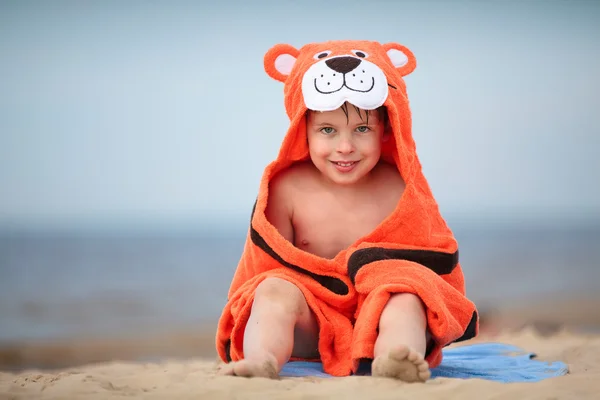 Cute little boy wearing tiger towel outdoors — Stock Photo, Image