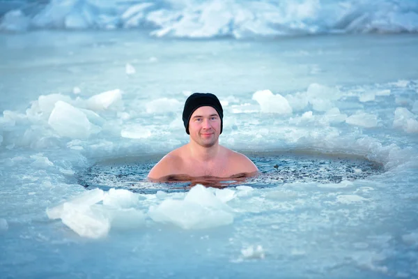 Winter swimming. Man in an ice-hole — Stock Photo, Image